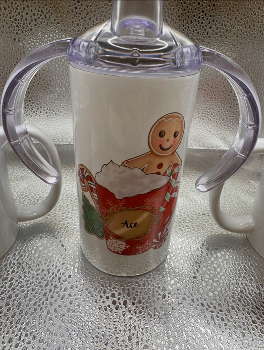 Child’s sippy cup with several lids and straw