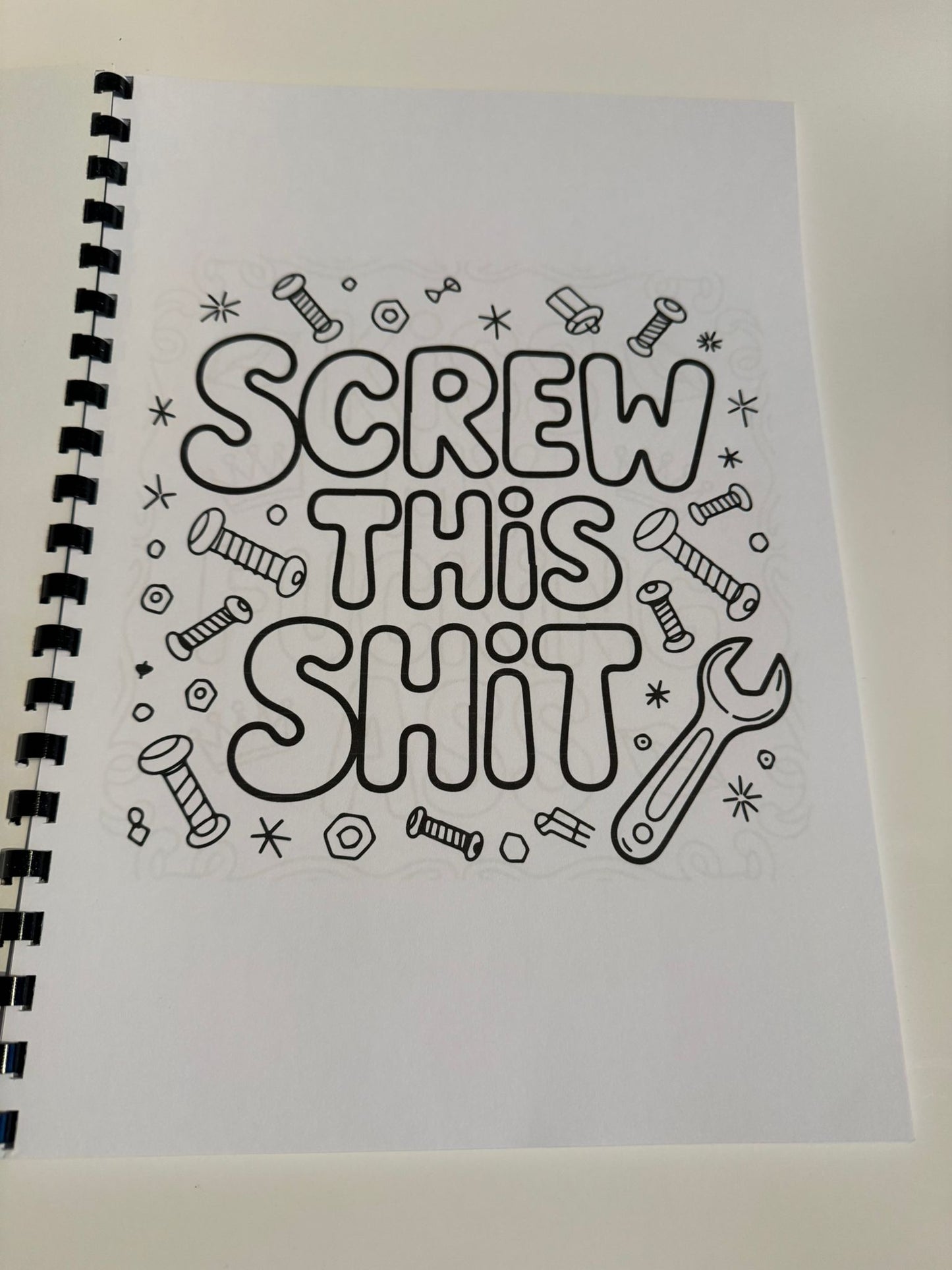 Swearing colouring book with thick 120 gsm paper, plastic comb, card back cover, plastic film and glossy front cover